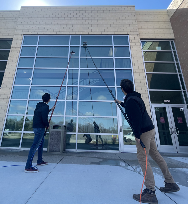 professional commercial window cleaners cleaning brick commercial windows