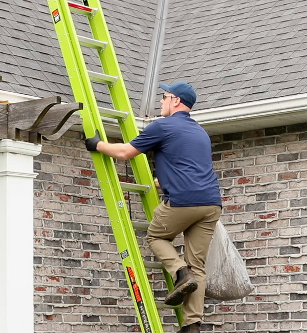 gutter cleaning professional climbing ladder